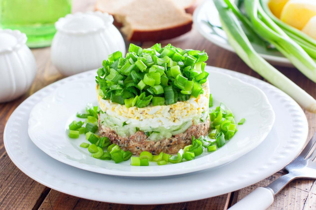 Salad with canned saury, cucumber and egg