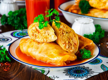 Stuffed cabbage rolls with minced chicken and rice in a saucepan