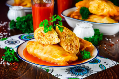 Stuffed cabbage rolls with minced chicken and rice in a saucepan