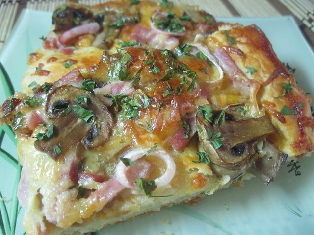 Homemade pizza with mushrooms