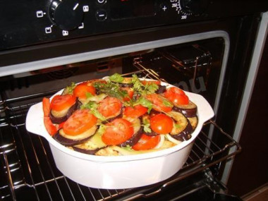 Chicken and potatoes, eggplant and tomatoes in foil