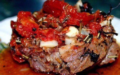 French pork meat with tomatoes and mushrooms and potatoes