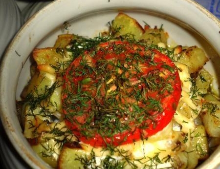 Chicken in a pot with potatoes roast