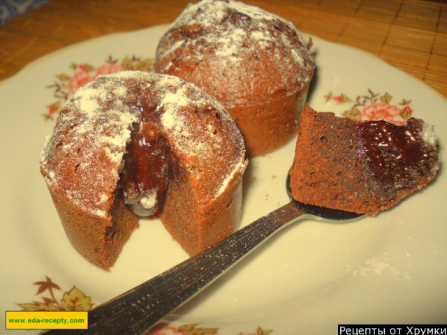 Cupcakes with liquid chocolate filling in molds