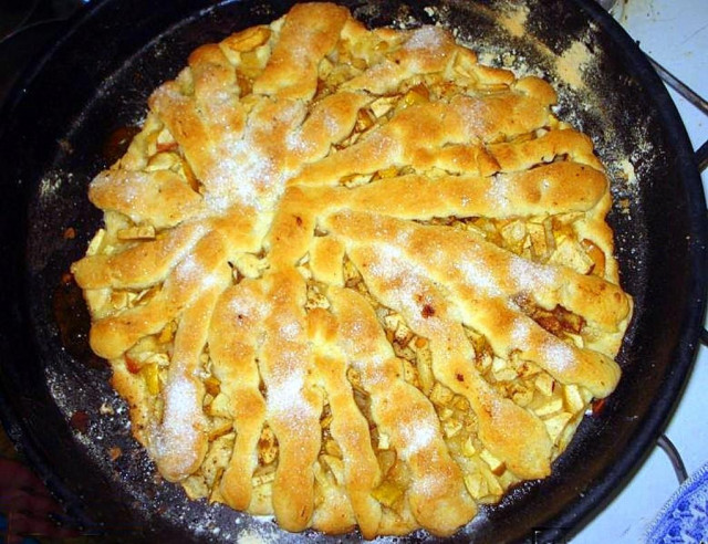 Shortbread walnut pie with nuts, raisins and apples