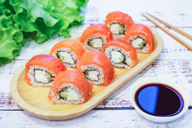 Rolls with red fish and cucumber at home