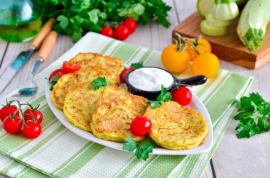 Fluffy zucchini pancakes on frying pan