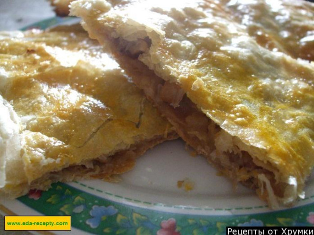 Strudel apple pie with raisins and nuts from puff pastry