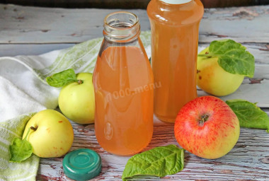 Apple juice in a juicer for winter