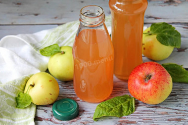 Apple juice in a juicer for winter