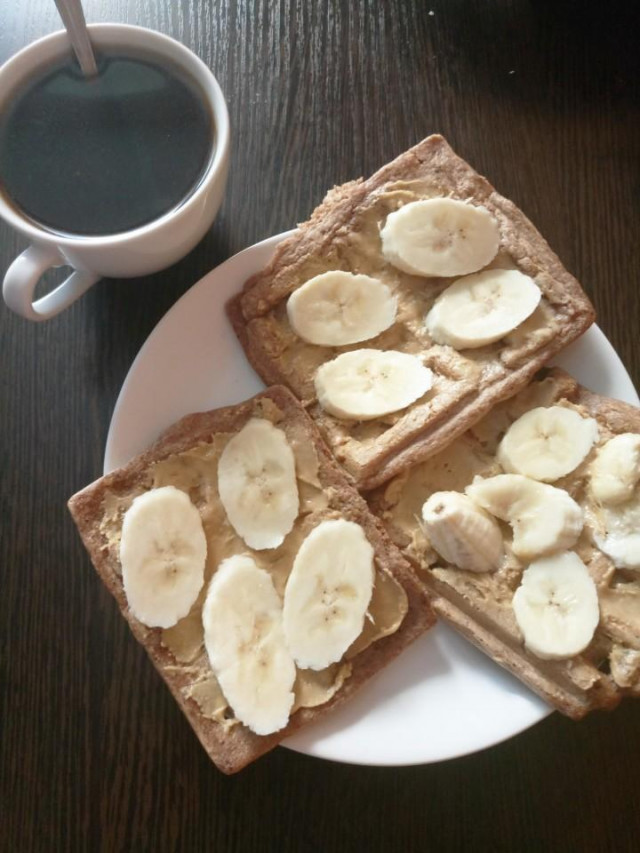 Chocolate waffles with banana and peanut paste