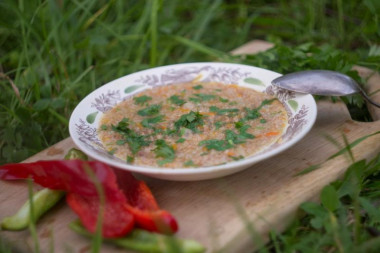 Field porridge on a campfire in a cauldron