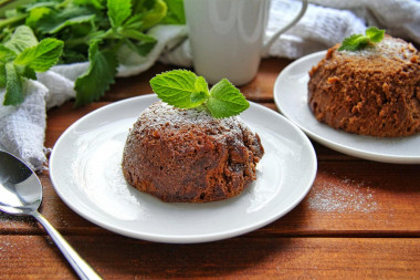 Chocolate cupcake in a mug in the microwave