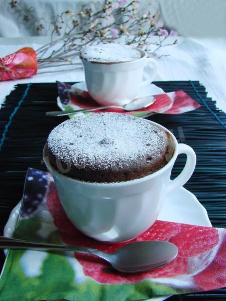 Chocolate cupcake in a mug in the microwave for 3 minutes