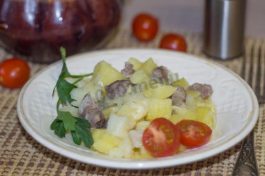 Pork meat and potatoes in pots in the microwave