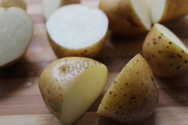 Potatoes with salt in a uniform in microwave oven