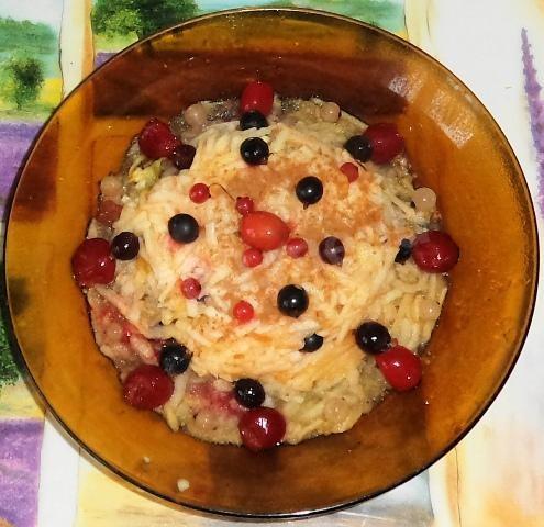 Apples in the microwave with berries and cinnamon