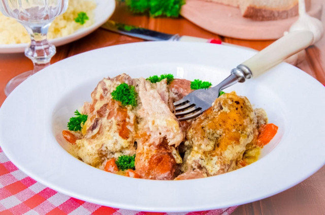 Stewed rabbit in sour cream in a slow cooker