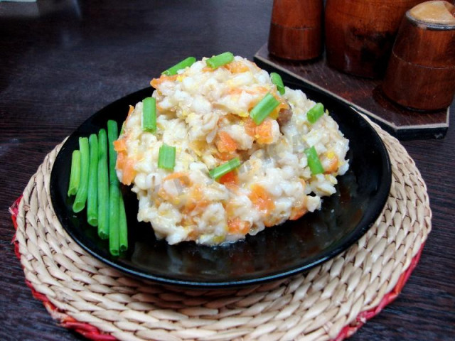 Pearl porridge with stewed meat in a slow cooker