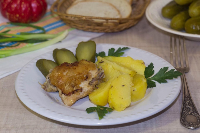 Chicken thighs in a slow cooker with potatoes