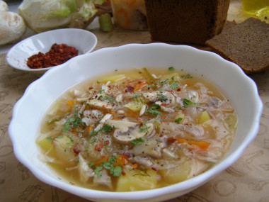 Lean cabbage soup from fresh and sauerkraut in a slow cooker