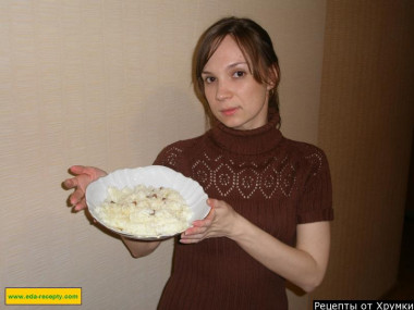 Rice porridge with dried fruits in a slow cooker with milk