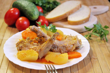 Rabbit in a cauldron stewed with potatoes