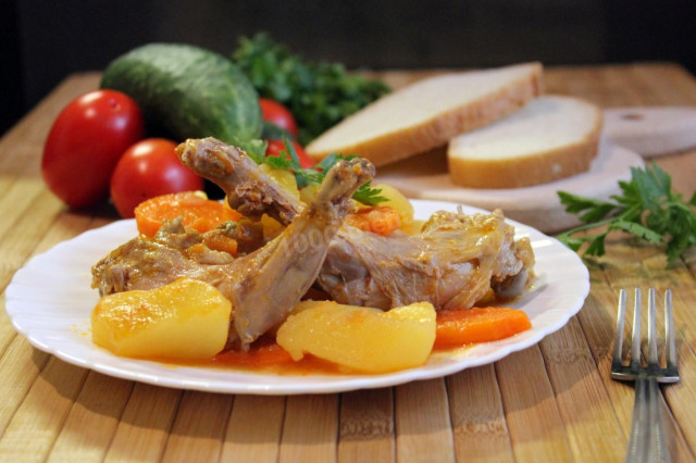 Rabbit in a cauldron stewed with potatoes