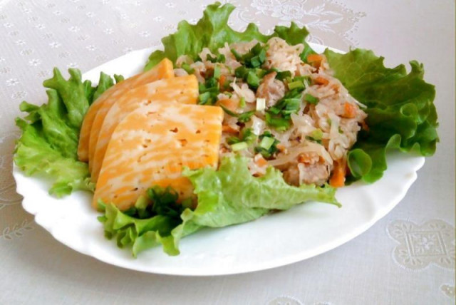 Cabbage stewed with rabbit in sour cream in a slow cooker