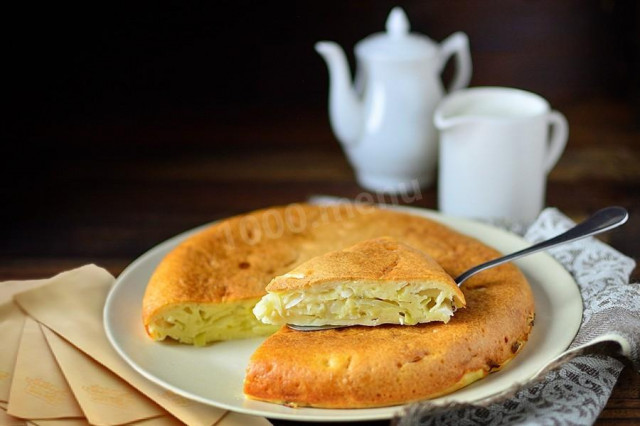 Aspic cabbage pie with cheese and herbs in a slow cooker