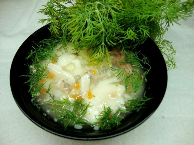 Soup with pasta, potatoes and meat in slow cooker