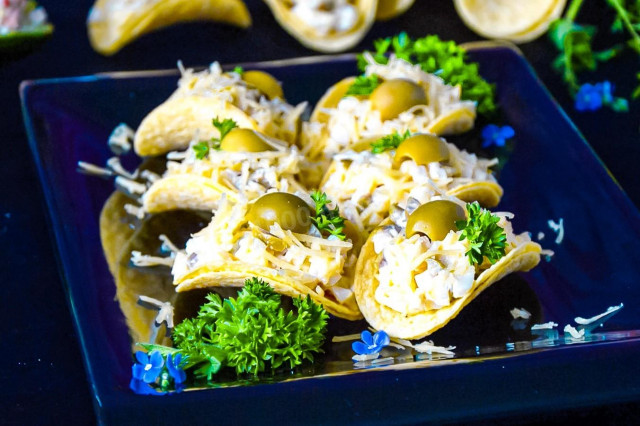 Cheese snack with fish on chips