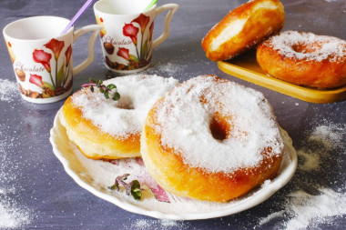 Homemade doughnuts in a pan with yeast