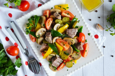 Salad with meat, mushrooms and cucumbers