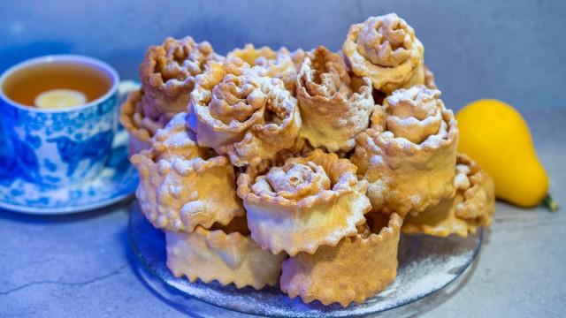 Cookies Brushwood in the form of roses from egg dough