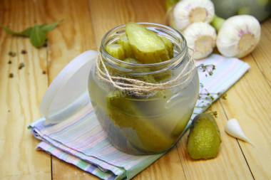 Pickled cucumbers under a nylon lid for winter