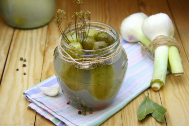 Pickled cucumbers under a nylon lid for winter