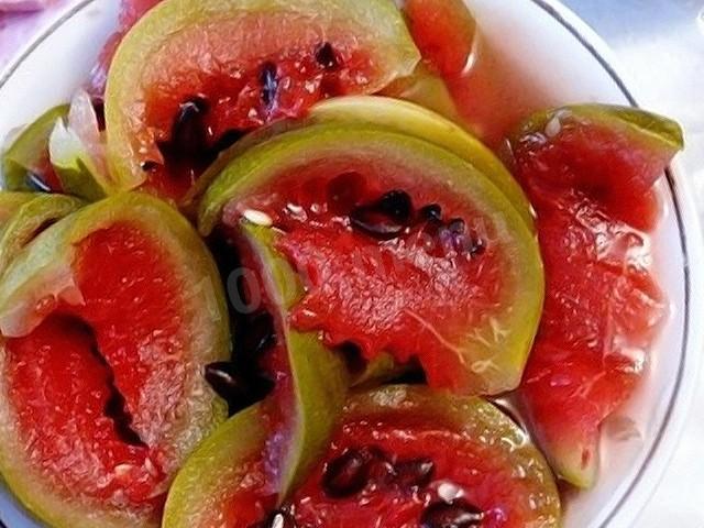 Salting watermelons in a barrel for winter