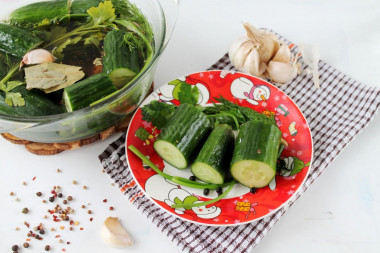 Lightly salted cucumbers in brine in a saucepan