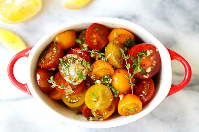 Lightly salted tomatoes in a saucepan