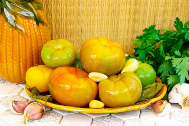 Pickled green tomatoes in a jar as cask