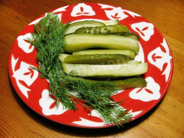 Delicious lightly salted cucumbers with horseradish in a saucepan