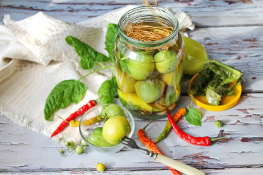 Pickled green tomatoes for winter in jars