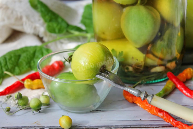 Pickled green tomatoes for winter in jars