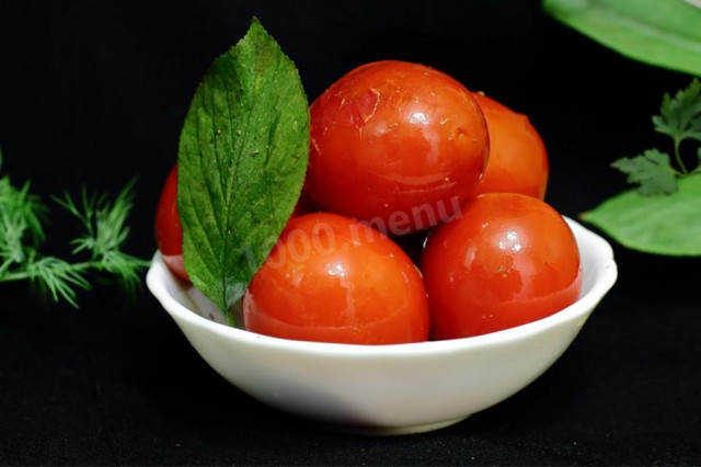 Pickled red tomatoes in a saucepan