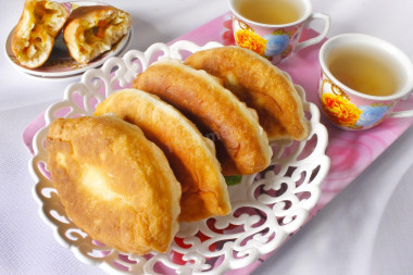 Pies with cabbage on kefir fried in a frying pan