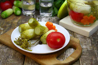 Pickled cucumbers with tomatoes for winter. Assorted vegetables