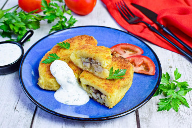 Potato zrazy with mushrooms in a frying pan