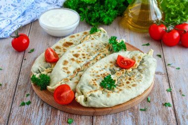 Tortillas with herbs in a frying pan