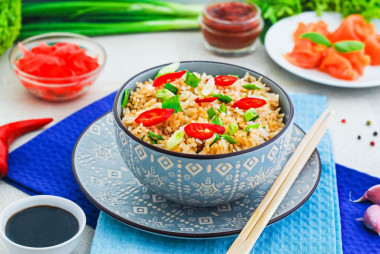 Rice with soy sauce in a frying pan